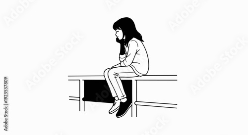 A thoughtful girl in casual clothes sits on the edge of a desk