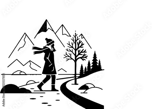 A lone figure walks through a winter landscape with mountains, trees, and a winding path
