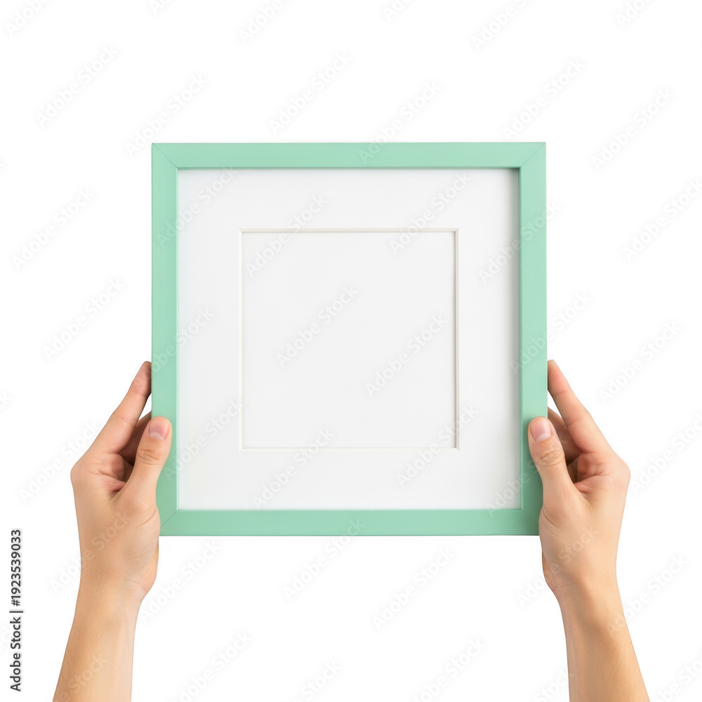 Obraz premium A person holding a blank white canvas framed by a mint green border. isolated on transparent background