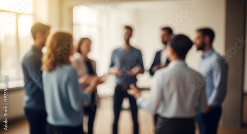 A group of diverse business professionals standing in a circle and communicating effectively