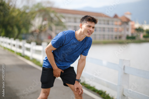 Canvastavla Athletic man experiencing groin pain while exercising outdoors, illustrating hernia symptoms, sports injury, and the importance of early medical attention