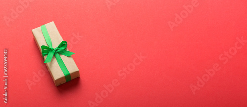 Wallpaper Mural Wrapped christmas or other holiday handmade present in craft paper with colored ribbon. Present box, decoration of gift on table, top view with copy space Torontodigital.ca