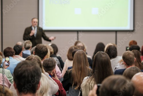Wallpaper Mural Business presentation in conference room, focused audience listening to speaker, lecture and public meeting atmosphere, professional event and learning environment. Torontodigital.ca
