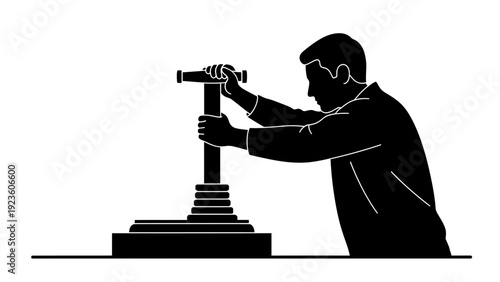 Silhouette of a man operating a manual press machine or pump. Industrial work and manual labor concept.