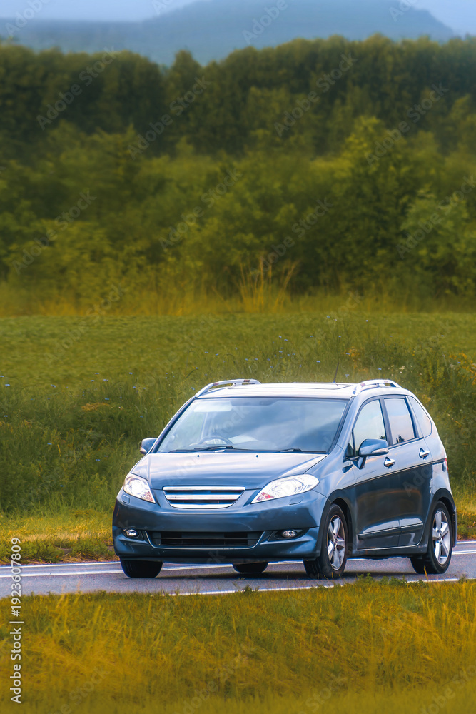 Fototapeta premium Crossover MPV family vehicle on open motorway