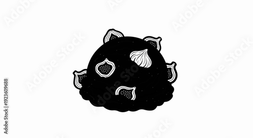 Black ice cream scoop with fig slices and garlic bulbs as toppings