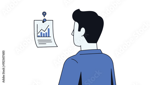 Man analyzing business data on a graph displayed on a paper pinned to a white wall