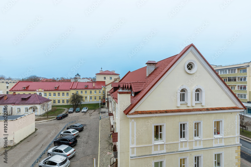 Obraz premium European City Courtyard with Historical Architecture and Red Roofs