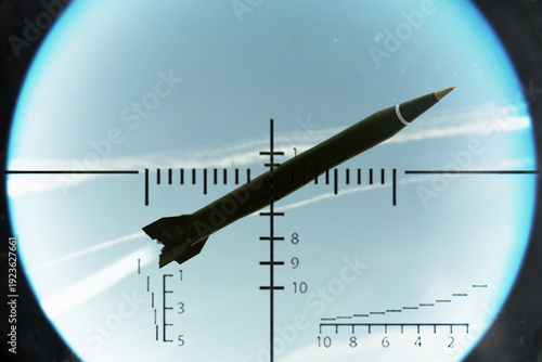 Fotografie Military missile in the sky captured by air defense sight reticle during interce