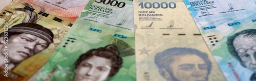Photos Venezuelan bolivar money bills pile on table