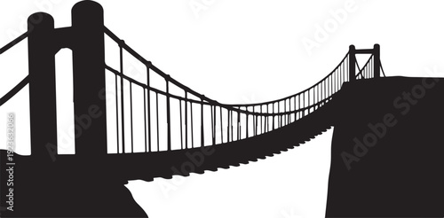 Silhouette of a suspension bridge over a deep gorge