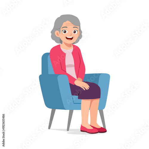 Happy senior woman smiling cheerfully while sitting comfortably in a blue armchair