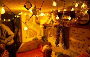 Fairy lights in camper with family in background