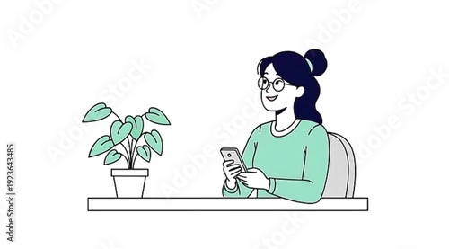 Young woman with glasses looking at her smartphone at a desk next to a potted plant