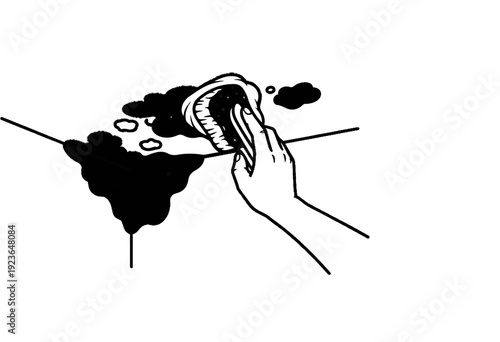 Hand using a brush to clean a dark stain on a surface