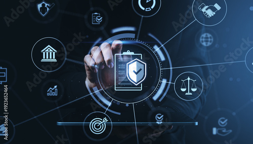 Fotografía Businessman interacting with digital compliance and legal icons using futuristic interface on dark blue background, illustrating secure governance concept