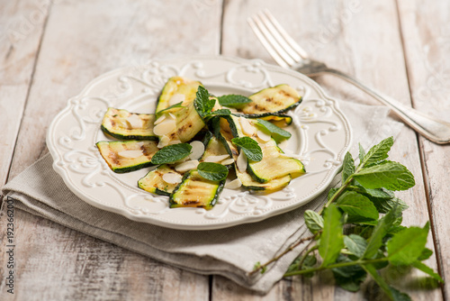 grilled zucchinis with sliced almonds and mint