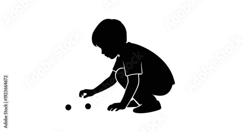 A child kneels and picks up balls on the floor byo