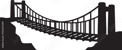 Black silhouette of a suspension bridge over a canyon