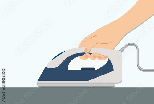 Womans hand with electric iron isolated on background.