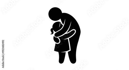 A man gently hugs a little girl byo in a warm embrace indoors.