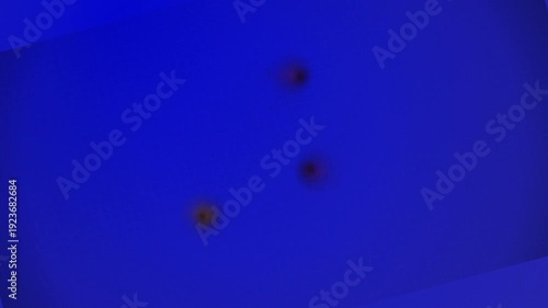Close-up of three rivets on a blue metal surface with a shallow depth of field.