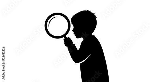 A child explores with a magnifying glass closely.