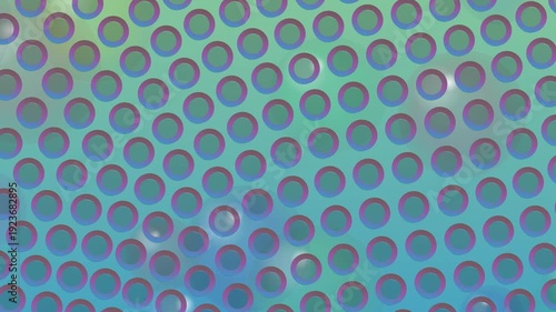 Close-up view of a colorful metal grate with circular holes on a blue background