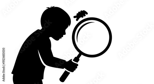 A child uses a magnifying glass to examine an insect closely byo