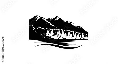 Silhouette of a mountain range with a glacial ice face meeting water
