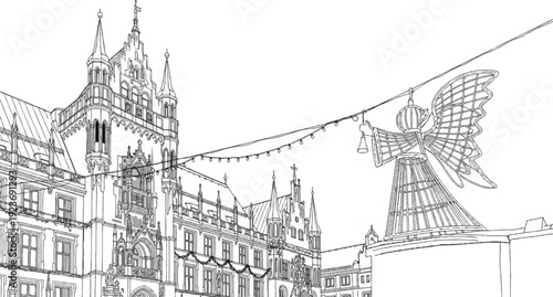 Ornate building and angel statue adorned with festive lights