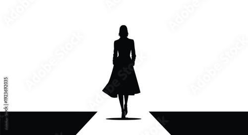 A solitary female silhouette wearing a coat walks confidently forward on a minimalist black and white fashion runway.