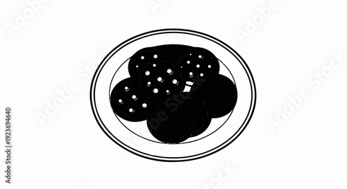 Round cookies with white dots on a plate
