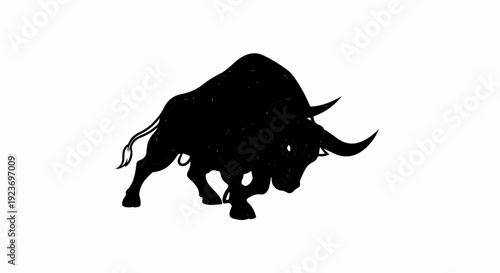 Powerful black silhouette of a charging bull with large horns