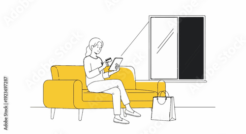Person on yellow couch using tablet and credit card, shopping bag nearby