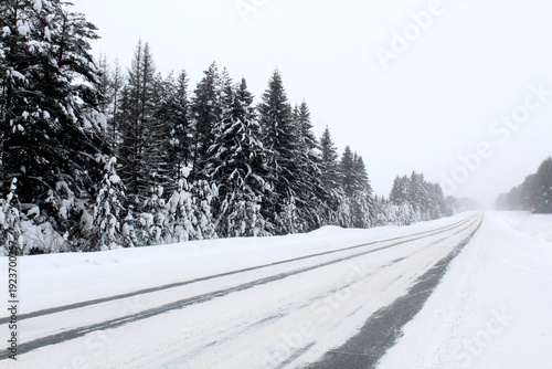 Winter track for cars covered with snow.
