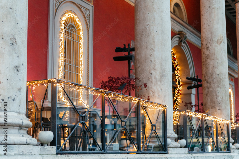 Naklejka premium Elegant European architecture featuring ornate facades, classical columns, and historic buildings in an urban city setting. 
