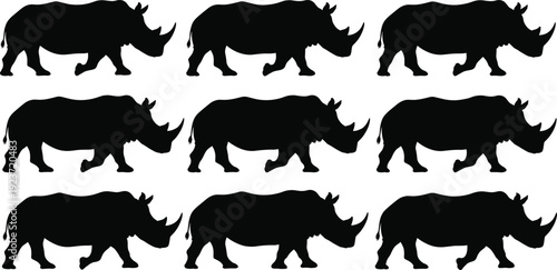 Collection of black rhinoceros silhouettes in various walking and standing poses isolated on white background for wildlife safari and conservation designsCollection of black r