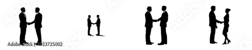 Silhouette of two business partners performing a firm handshake