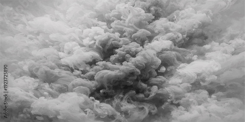 Black and white smoke rises from the tree against a fluffy cumulus cloudscape and a bright winter sun in the aerial atmosphere