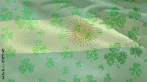 Breeze starting, blue striped flag rippling while clover overlay drifting, accenting Sun emblem