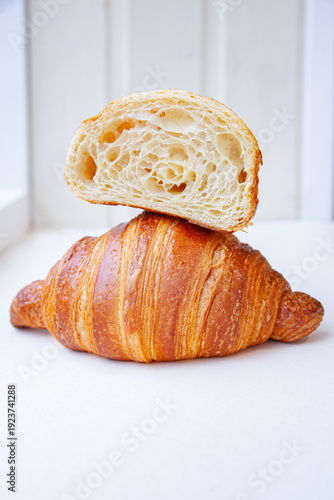 fresh croissant on wooden table