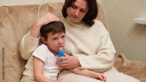 Woman helping child with inhalation therapy. Mother assisting sick kid with respiratory treatment for cough, cold, asthma. Nebulizer medicine delivery for lung health.