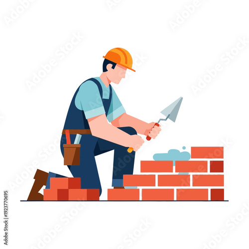 Construction worker building brick wall with trowel and mortar