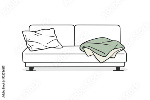 Traces of human presence. A wrinkled pillow and loosely folded blanket remain on a sofa, capturing rest after it has ended. The scene feels intimate, soft, and
