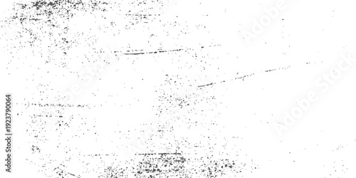 Abstract grunge background featuring a black ink splat pattern on a vintage textured paper surface with a dirty gray concrete wall design