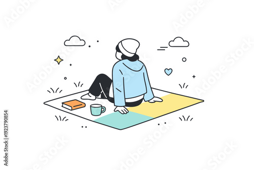 Blankets on still-cool grass. A person sitting on a blanket spread over pale spring grass, light jacket on. Early outdoor rest, gentle balance between comfort
