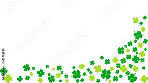 A cluster of green shamrocks scattered across the lower right corner of the image, viewed from directly above.