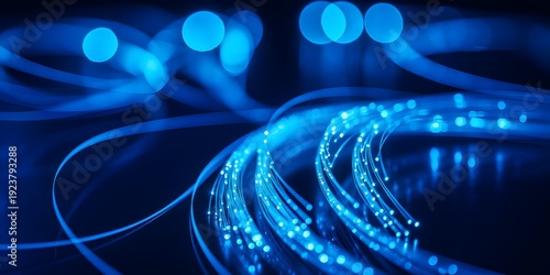 A close-up view of glowing blue fiber optic cables in a dark background