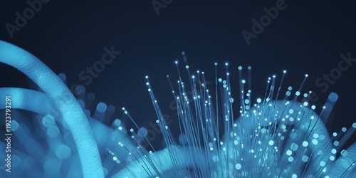 A close-up view of a fiber optic cable with glowing blue light